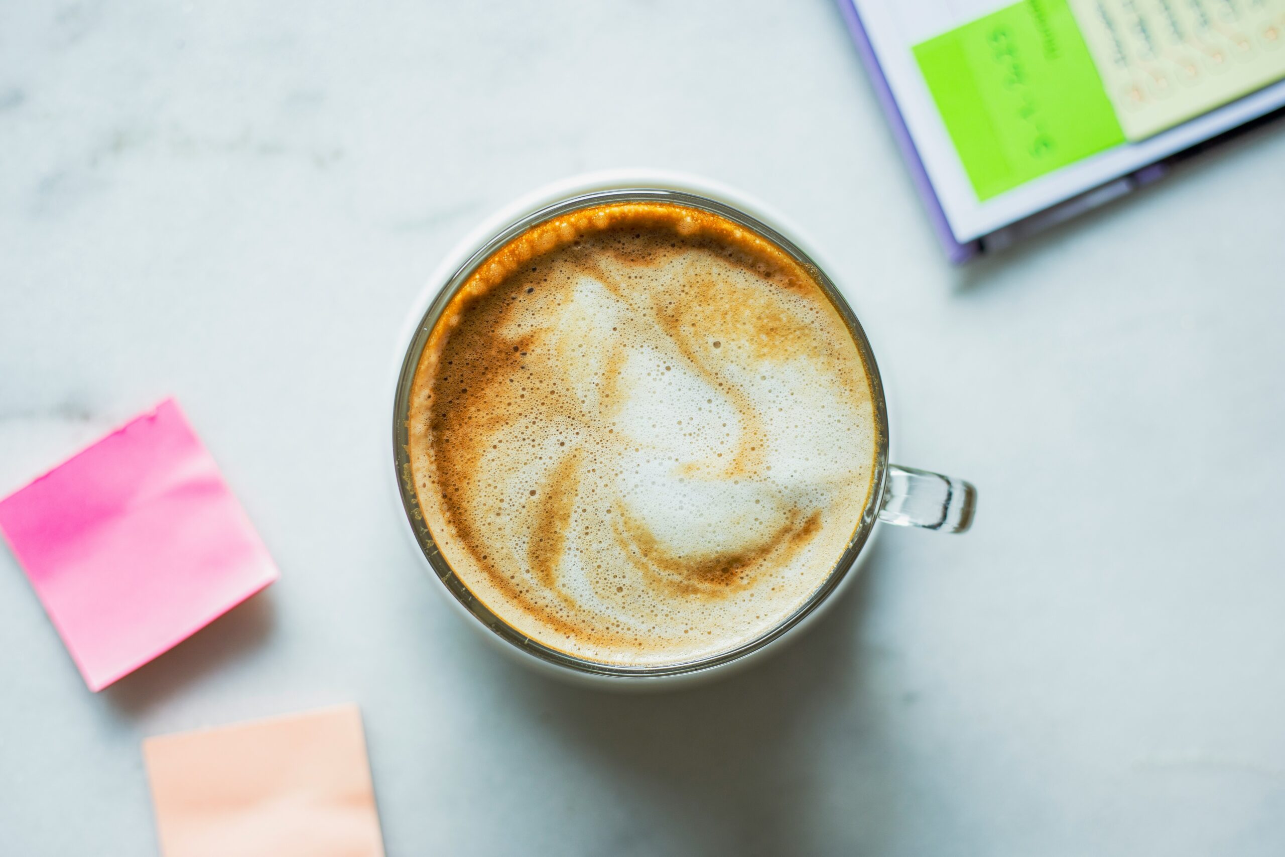 a cup of coffee sitting on top of a table